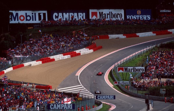 Winner Michael Schumacher(GER) Ferrari F310 is chased through the famous Eau Rouge corner by 2nd placed Villeneuve Belgian Grand Prix, Spa-Francorchamps, 25th August 1996