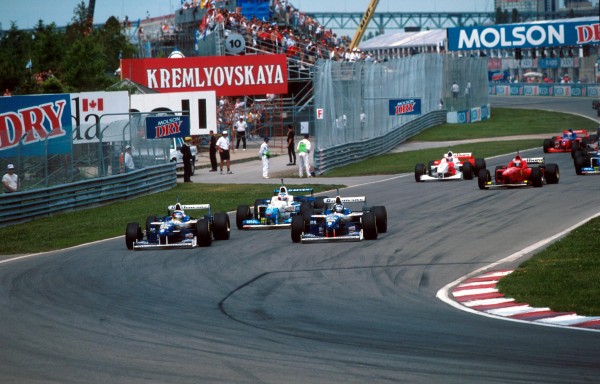 First corner, winner Damon Hill (GBR) Williams FW18 gets the inside line over team mate Jacques Villeneuve (CDN) Williams FW18 at the start of the race. Canadian Grand Prix, Montreal, 16th June 1996