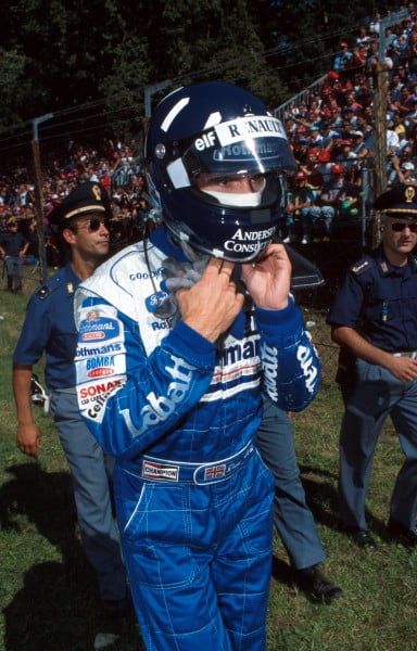 Damon Hill(GBR) Williams FW18 walks back to the pits after retiring Italian GP Monza, 8th September 1996