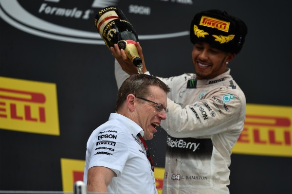Lewis Hamilton (GBR) Mercedes AMG F1 celebrates with Andy Cowell (GBR) Managing Director, Mercedes AMG High Performance Powertrains and the champagne on the podium at Formula One World Championship, Rd15, Russian Grand Prix, Race, Sochi Autodrom, Sochi, Krasnodar Krai, Russia, Sunday 11 October 2015.