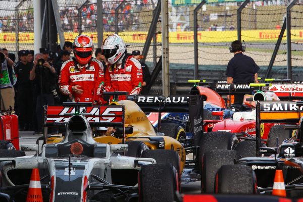 Formula One World Championship 2016, Round 3, Chinese Grand Prix, Shanghai, China, Sunday 17 April 2016 - L to R): Kimi Raikkonen (FIN) Ferrari with team mate Sebastian Vettel (GER) Ferrari in parc ferme.