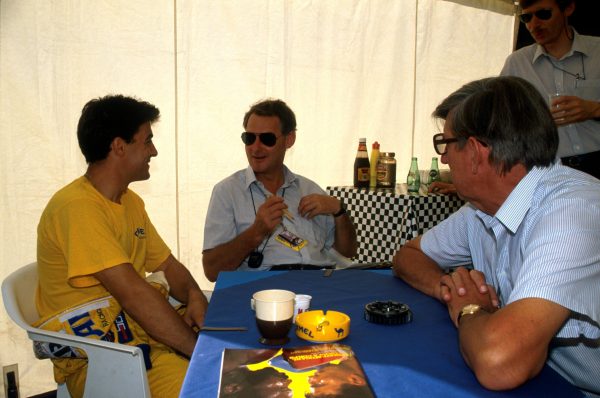 Tyrrell desiger Harvey Postlethwaite (Centre) and team owner Ken Tyrrell (Right) talk with Jean Alesi (FRA) (Left) who replaced Michele Alboreto at Tyrrell and was a stunning fourth in his first F1 race. French Grand Prix, Paul Ricard, 9 July 1989.