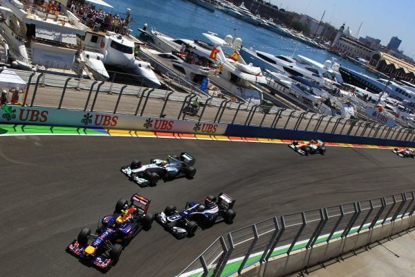 Mark Webber (AUS) Red Bull Racing RB8 and Pastor Maldonado (VEN) Williams FW34 battle. Formula One World Championship, Rd8, European Grand Prix, Race Day, Valencia, Spain, Sunday 24 June 2012. BEST IMAGE