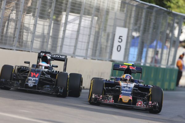 Formula One World Championship 2016, Round 8, European Grand Prix, Baku, Azerbaijan, Sunday 19 June 2016 - Jenson Button (GBR) McLaren MP4-31 and Carlos Sainz Jr (ESP) Scuderia Toro Rosso STR11 battle for position.