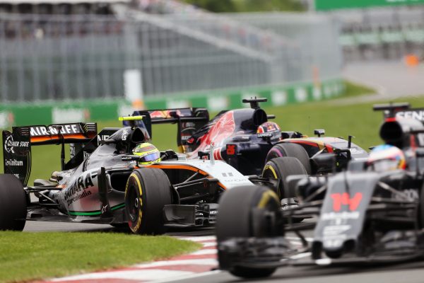 Formula One World Championship 2016, Round 7, Canadian Grand Prix, Montreal, Canada, Sunday 12 June 2016 - Sergio Perez (MEX) Sahara Force India F1 VJM09 and Daniil Kvyat (RUS) Scuderia Toro Rosso STR11 battle for position.