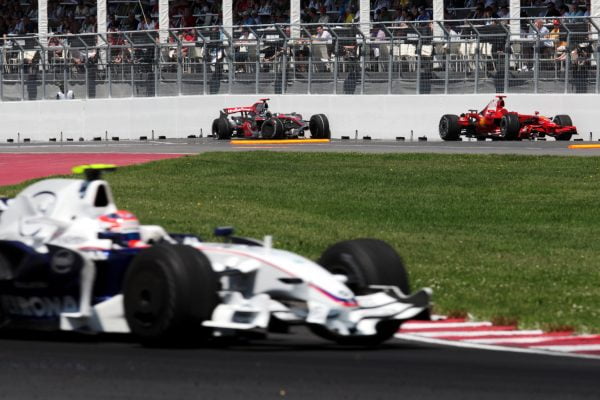 Robert Kubica (POL) BMW Sauber F1.08 passes the McLaren Mercedes MP4/23 of Lewis Hamilton (GBR) McLaren and the Ferrari F2008 of Kimi Raikkonen (FIN) Ferrari F2008. Formula One World Championship, Rd 7, Canadian Grand Prix, Race, Montreal, Canada, Sunday 8 June 2008.