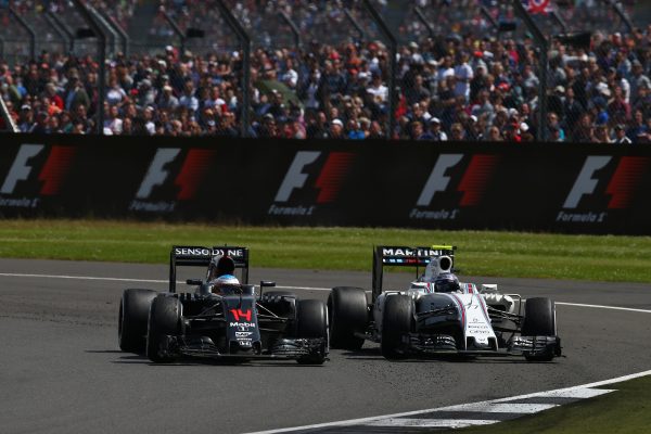 Formula One World Championship 2016, Round 10, British Grand Prix, Silverstone, England, Sunday 10 July 2016 - Fernando Alonso (ESP) McLaren Honda F1 Team MP4-31 and Valtteri Bottas (FIN) Williams Martini Racing FW38.