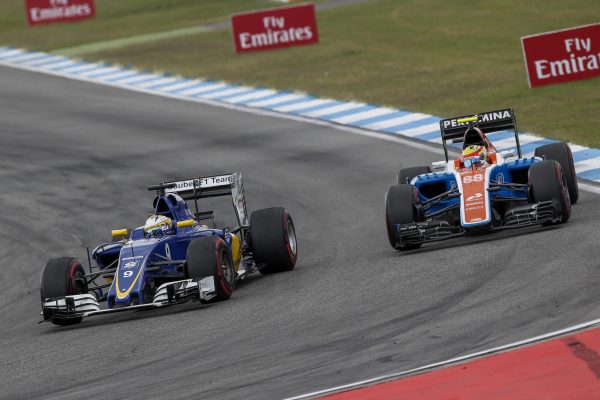 www.sutton-images.com Marcus Ericsson (SWE) Sauber C35 and Rio Haryanto (IDN) Manor Racing MRT05 battle at Formula One World Championship, Rd12, German Grand Prix, Race, Hockenheim, Germany, Sunday 31 July 2016.