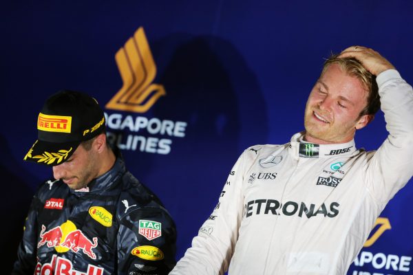 Formula One World Championship 2016, Round 15, Singapore Grand Prix, Singapore, Singapore, Sunday 18 September 2016 - Race winner Nico Rosberg (GER) Mercedes AMG F1 (Right) celebrates on the podium with second placed Daniel Ricciardo (AUS) Red Bull Racing.