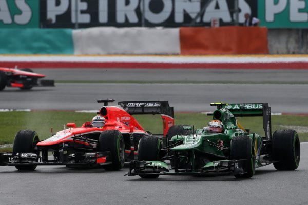 Giedo van der Garde (NED) Caterham CT03 and Jules Bianchi (FRA) Marussia F1 Team MR02. Formula One World Championship, Rd2, Malaysian Grand Prix, Race, Sepang, Malaysia, Sunday 24 March 2013.