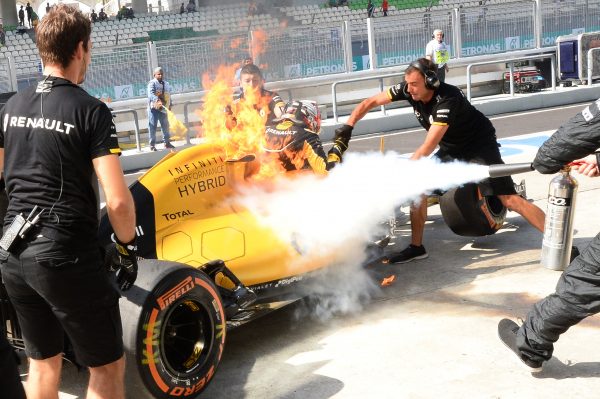 www.sutton-images.com Kevin Magnussen (DEN) Renault Sport F1 Team RS16 on fire in pit lane during FP1 at Formula One World Championship, Rd16, Malaysian Grand Prix, Practice, Sepang, Malaysia, Friday 30 September 2016.