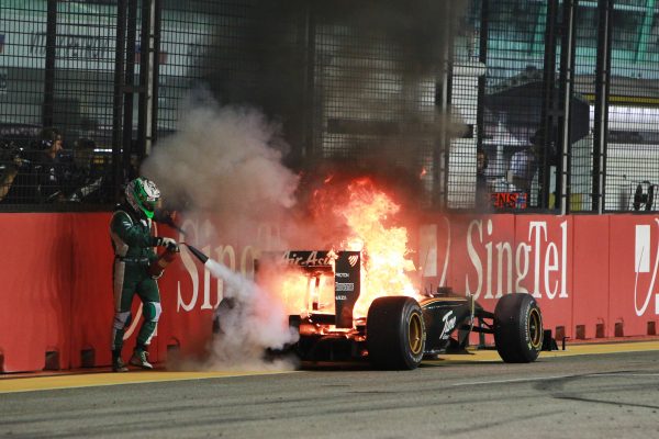 Heikki Kovalainen (FIN) Lotus T127 retires from the race on the final lap with a fire. Formula One World Championship, Rd 15, Singapore Grand Prix, Race, Marina Bay Street Circuit, Singapore, Sunday 26 September 2010. BEST IMAGE