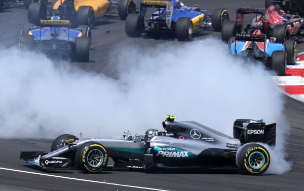 www.sutton-images.com Sebastian Vettel (GER) Ferrari SF16-H and Nico Rosberg (GER) Mercedes-Benz F1 W07 Hybrid collide at the start of the race at Formula One World Championship, Rd16, Malaysian Grand Prix, Race, Sepang, Malaysia, Sunday 2 October 2016.