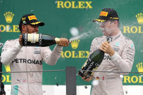 www.sutton-images.com Lewis Hamilton (GBR) Mercedes AMG F1 and Nico Rosberg (GER) Mercedes AMG F1 celebrate with the champagne on the podium at Formula One World Championship, Rd20, Brazilian Grand Prix, Race, Interlagos, Sao Paulo, Brazil, Sunday 13 November 2016.