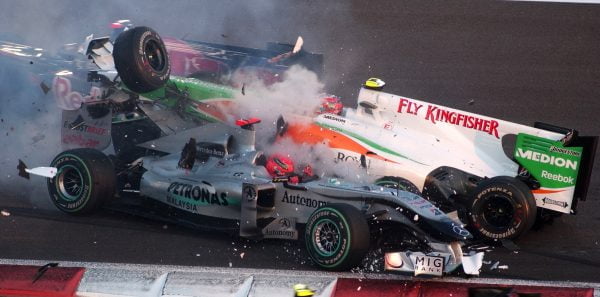 Michael Schumacher (GER) Mercedes GP MGP W01 spins and collects Vitantonio Liuzzi (ITA) Force India VJM03. Formula One World Championship, Rd 19, Abu Dhabi Grand Prix, Race, Yas Marina Circuit, Abu Dhabi, UAE, Sunday 14 November 2010. BEST IMAGE